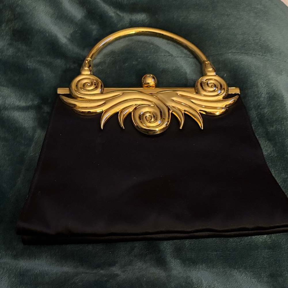 Chic Black and Gold Clutch with Artistic Handle